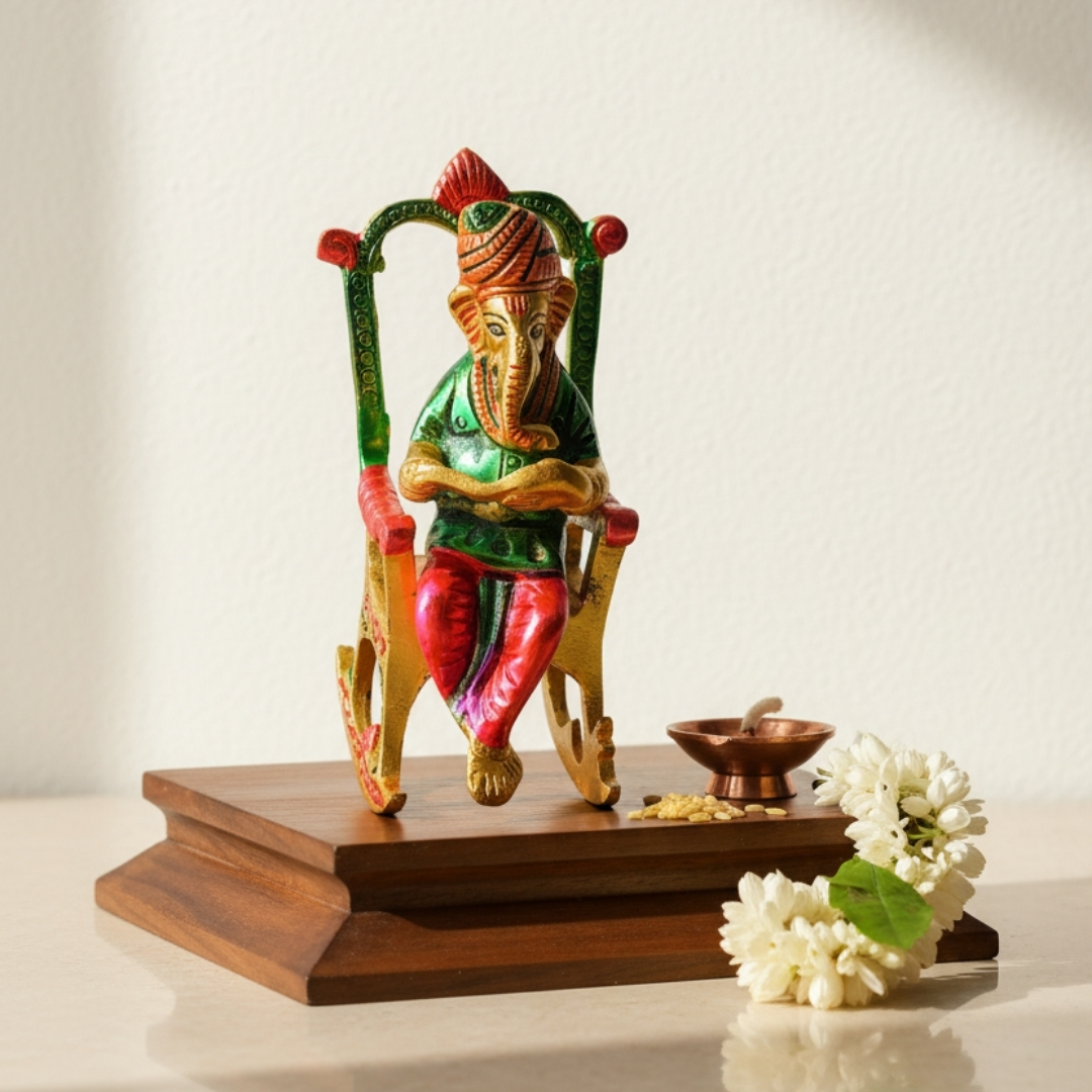 Ganesh ji on chair with reading book